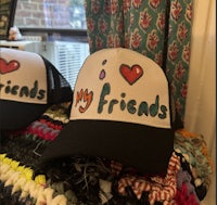 two hats with the words my friends on them